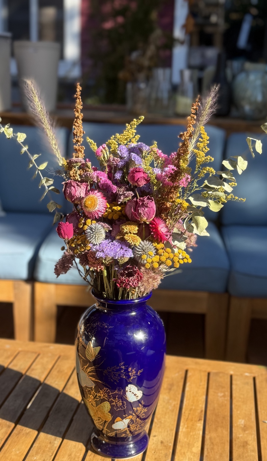 Midnight Butterfly Garden — colourful dried flowers in a cobalt-blue butterfly vase